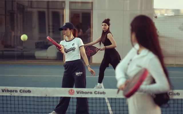 Group of women enjoying a padel match at Vibora Club in Baghdad, Iraq.