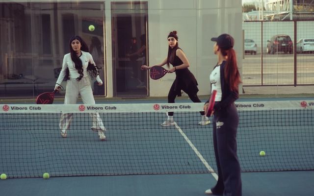 Women engaged in a padel tennis match at Vibora Club, Baghdad, Iraq.